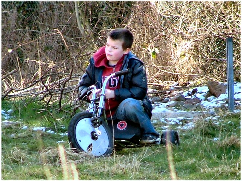 Child with bike out back